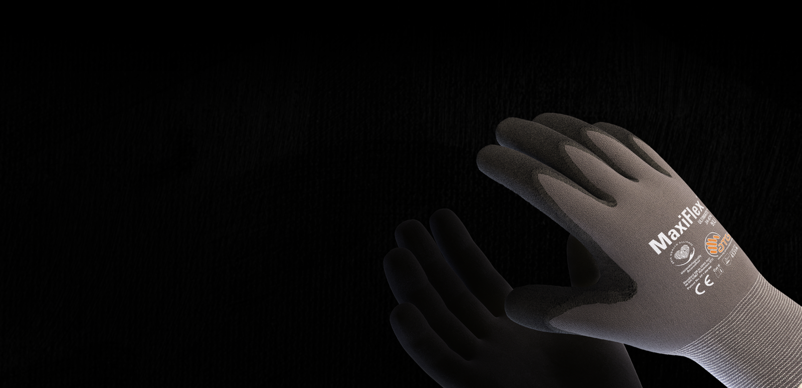 Protective work gloves being inspected